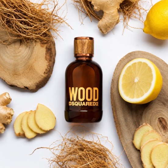 Dsquared2 Wood Pour Homme Eau de Toilette 100 ml con flacone su sfondo con limone, zenzero e legni, profumo da uomo dalle note legnose, agrumate e speziate.