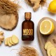 Dsquared2 Wood Pour Homme Eau de Toilette 100 ml con flacone su sfondo con limone, zenzero e legni, profumo da uomo dalle note legnose, agrumate e speziate.