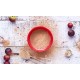 Polvere di Camu Camu (Myrciaria dubia) in ciotola rossa con cucchiaino dosatore, ingrediente naturale amazzonico utilizzato negli integratori Erbologica Amazonas Andes.
